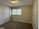 Simple bedroom with carpet and double doors at 3617 Collins Dr, Douglasville, GA 30135