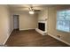 Living room with fireplace and wood-look floors at 3617 Collins Dr, Douglasville, GA 30135