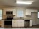 Kitchen with white cabinets, granite counters at 3617 Collins Dr, Douglasville, GA 30135