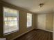 Bright entryway with wood-look floors and two windows at 3617 Collins Dr, Douglasville, GA 30135