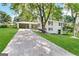 White brick ranch house with attached carport and landscaping at 6358 Joanna St, Lithia Springs, GA 30122