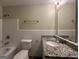 Bathroom with granite countertop and shower/tub combo at 6358 Joanna St, Lithia Springs, GA 30122