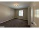 Charming bedroom with carpeted floor and large window at 6358 Joanna St, Lithia Springs, GA 30122