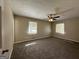 Spacious bedroom with carpeted floors and ceiling fan at 6358 Joanna St, Lithia Springs, GA 30122