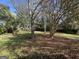 Spacious backyard with mature trees and grassy area at 6358 Joanna St, Lithia Springs, GA 30122