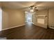 Living room with brick fireplace and hardwood floors at 6358 Joanna St, Lithia Springs, GA 30122