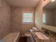 Bathroom with granite countertop and updated tile at 4778 Glenwood Rd, Decatur, GA 30035