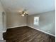 Spacious living room with hardwood floors and ceiling fan at 3564 Glenwood Rd, Decatur, GA 30032