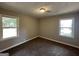 Spacious bedroom with wall-to-wall carpeting and dual windows at 3564 Glenwood Rd, Decatur, GA 30032