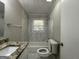 Clean bathroom with granite vanity and tiled shower/tub at 3564 Glenwood Rd, Decatur, GA 30032