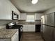 Modern kitchen with granite countertops and stainless steel appliances at 3564 Glenwood Rd, Decatur, GA 30032