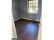 Simple bedroom with dark wood-look flooring and a window at 6420 Woodstone Ter, Morrow, GA 30260