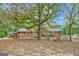 Brick home with spacious backyard, large trees, and playset at 115 Bernhard Rd, Fayetteville, GA 30215
