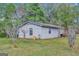 White detached garage with a single window at 115 Bernhard Rd, Fayetteville, GA 30215