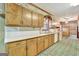 Bright kitchen featuring wood cabinets, ample counter space, and a microwave at 115 Bernhard Rd, Fayetteville, GA 30215