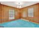 Bright office space with wood paneling and large windows at 115 Bernhard Rd, Fayetteville, GA 30215