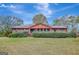 Brick ranch house with landscaped yard and spacious lawn at 115 Bernhard Rd, Fayetteville, GA 30215
