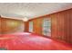 Formal dining room with wood paneling and chandelier at 115 Bernhard Rd, Fayetteville, GA 30215