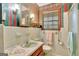 Retro bathroom with striped wallpaper and updated sink at 115 Bernhard Rd, Fayetteville, GA 30215