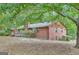 Brick house back view with a deck and large yard at 115 Bernhard Rd, Fayetteville, GA 30215