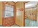 Functional laundry room with built-in shelving and exterior access at 115 Bernhard Rd, Fayetteville, GA 30215