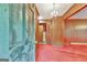 Entryway with red carpet, wood paneling, and chandelier at 115 Bernhard Rd, Fayetteville, GA 30215