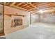 Unfinished basement with brick fireplace and ample space at 115 Bernhard Rd, Fayetteville, GA 30215