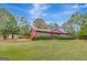 Ranch house with a large front yard and detached garage at 115 Bernhard Rd, Fayetteville, GA 30215