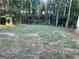Spacious backyard with lush green lawn and lots of shade trees at 2893 Franklin Rd, Lawrenceville, GA 30044