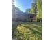 Back view of a single-story home with a grassy backyard at 2893 Franklin Rd, Lawrenceville, GA 30044