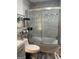 Bathroom features tiled shower and tub combo, white toilet, and tile flooring at 2893 Franklin Rd, Lawrenceville, GA 30044