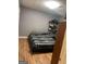 Bedroom with wood-look flooring, a bed, and storage shelves at 2893 Franklin Rd, Lawrenceville, GA 30044