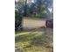 Backyard view of a home with attached outbuilding and some landscaping at 2893 Franklin Rd, Lawrenceville, GA 30044