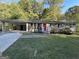 Ranch house with red front door and carport at 3850 Bright Star Rd, Douglasville, GA 30135