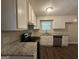 Kitchen with white cabinets, granite countertops, and appliances at 3850 Bright Star Rd, Douglasville, GA 30135