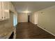 Open dining area with dark hardwood floors and access to kitchen at 3850 Bright Star Rd, Douglasville, GA 30135