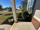 Well-maintained front porch with landscaping and a brick walkway at 7671 Watson Cir, Locust Grove, GA 30248