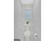 Small, clean bathroom with white toilet and fixtures at 2147 Mcafee Rd, Decatur, GA 30032