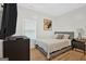 Comfortable bedroom with a queen bed and hardwood floors at 2147 Mcafee Rd, Decatur, GA 30032