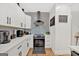 Modern kitchen with white cabinets and black accents at 2147 Mcafee Rd, Decatur, GA 30032