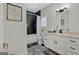 Modern bathroom with white cabinets, patterned floor, and soaking tub at 2147 Mcafee Rd, Decatur, GA 30032