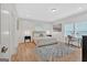 Bright bedroom with hardwood floors, large bed, and home office space at 2147 Mcafee Rd, Decatur, GA 30032