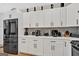Modern white kitchen with stainless steel appliances at 2147 Mcafee Rd, Decatur, GA 30032