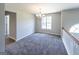 Spacious dining area with carpet, chandelier, and view to the living room at 5120 Roxton Ln, Douglasville, GA 30135