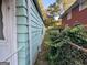 Side of teal house with ivy and fence at 1121 Montreat Sw Ave, Atlanta, GA 30310