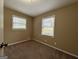 Bright bedroom with carpet and two windows at 2929 Stratford Mill Rd, Lithonia, GA 30038