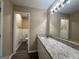 Bathroom with granite countertop, white cabinets and a separate toilet area at 2929 Stratford Mill Rd, Lithonia, GA 30038