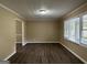 Spacious living room featuring hardwood floors and large windows at 2929 Stratford Mill Rd, Lithonia, GA 30038