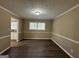 Bright dining room with hardwood floors and view into kitchen at 2929 Stratford Mill Rd, Lithonia, GA 30038