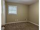 Well-lit bedroom with carpet and a window at 2929 Stratford Mill Rd, Lithonia, GA 30038